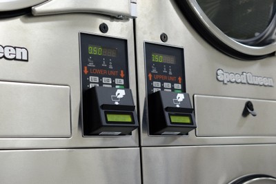 Speed Queen stack dryer control panels with digital displays and Laundroworks card readers