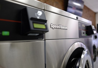 Close-up of a brand new Speed Queen washer with the Laundroworks card reader